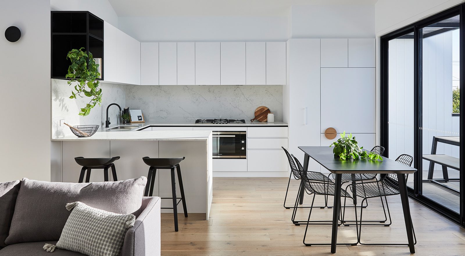 Open-plan kitchen and dining with whole-home ducted air conditioning